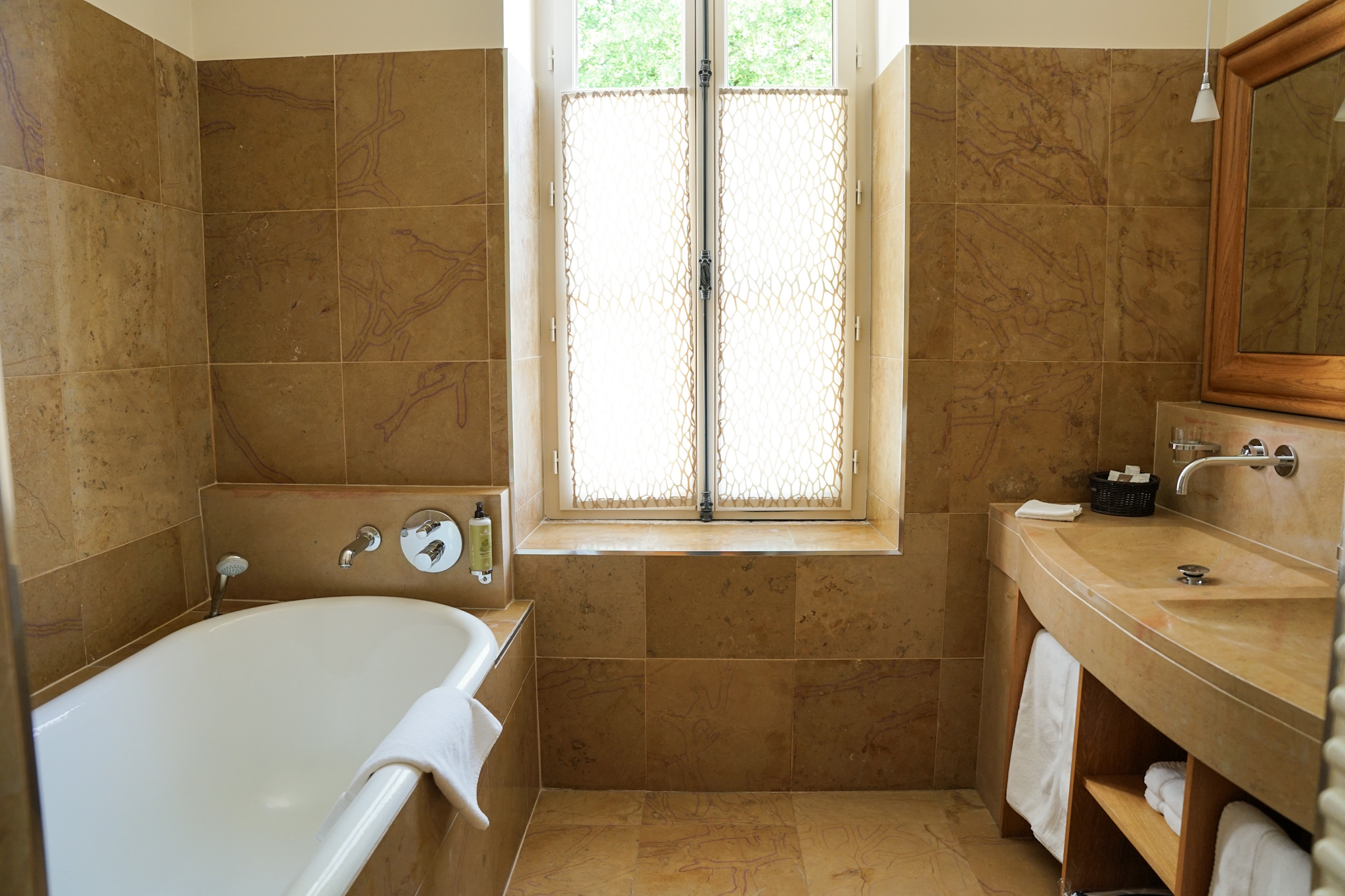 French Flair Burgundy Bathroom at Hostellerie de Levernois