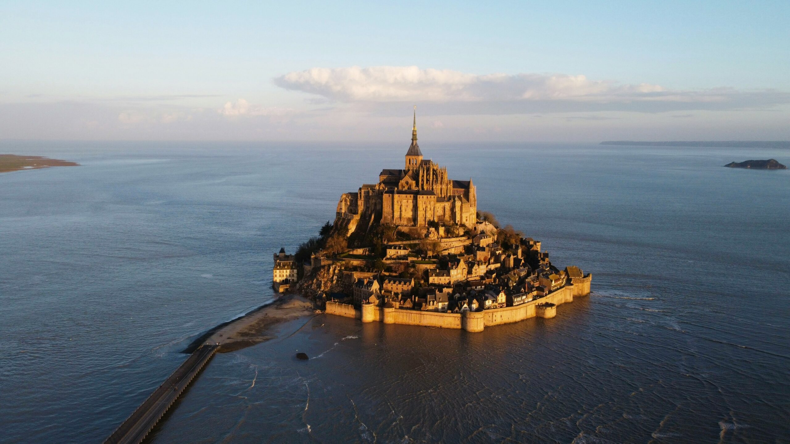 French Flair Normandy Mont Saint Michel surrounded by water view from the sky